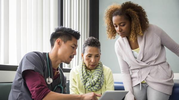 Healthcare professional and patients discussing treatments